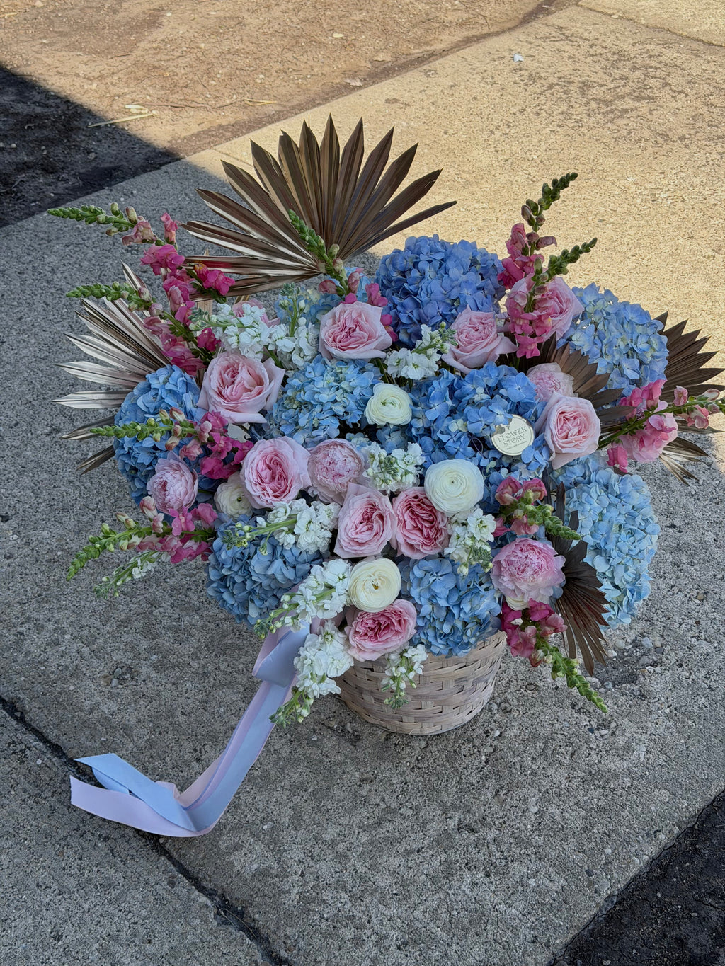 Soft mixed blooms in a basket