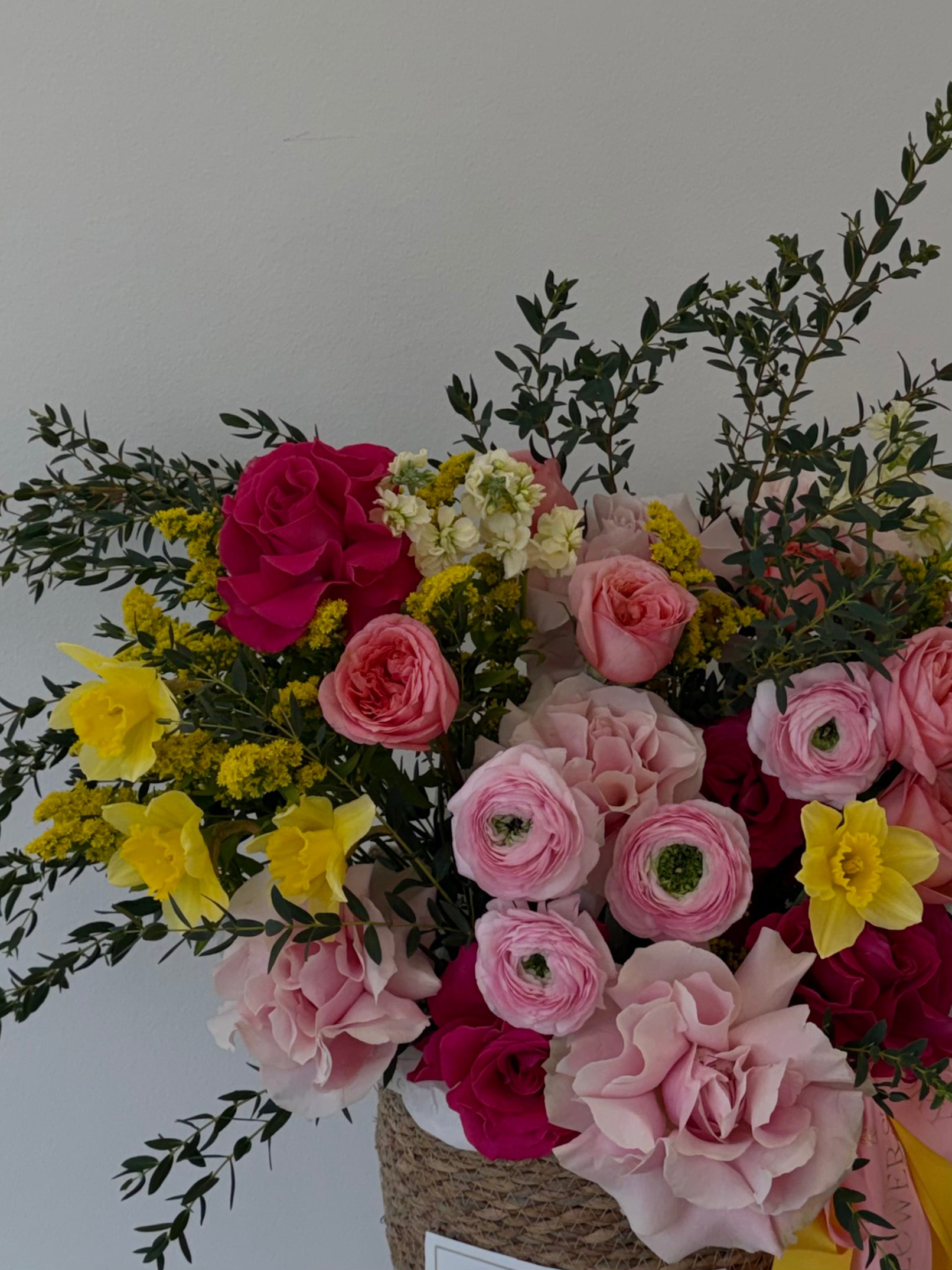 Soft mixed blooms in a basket