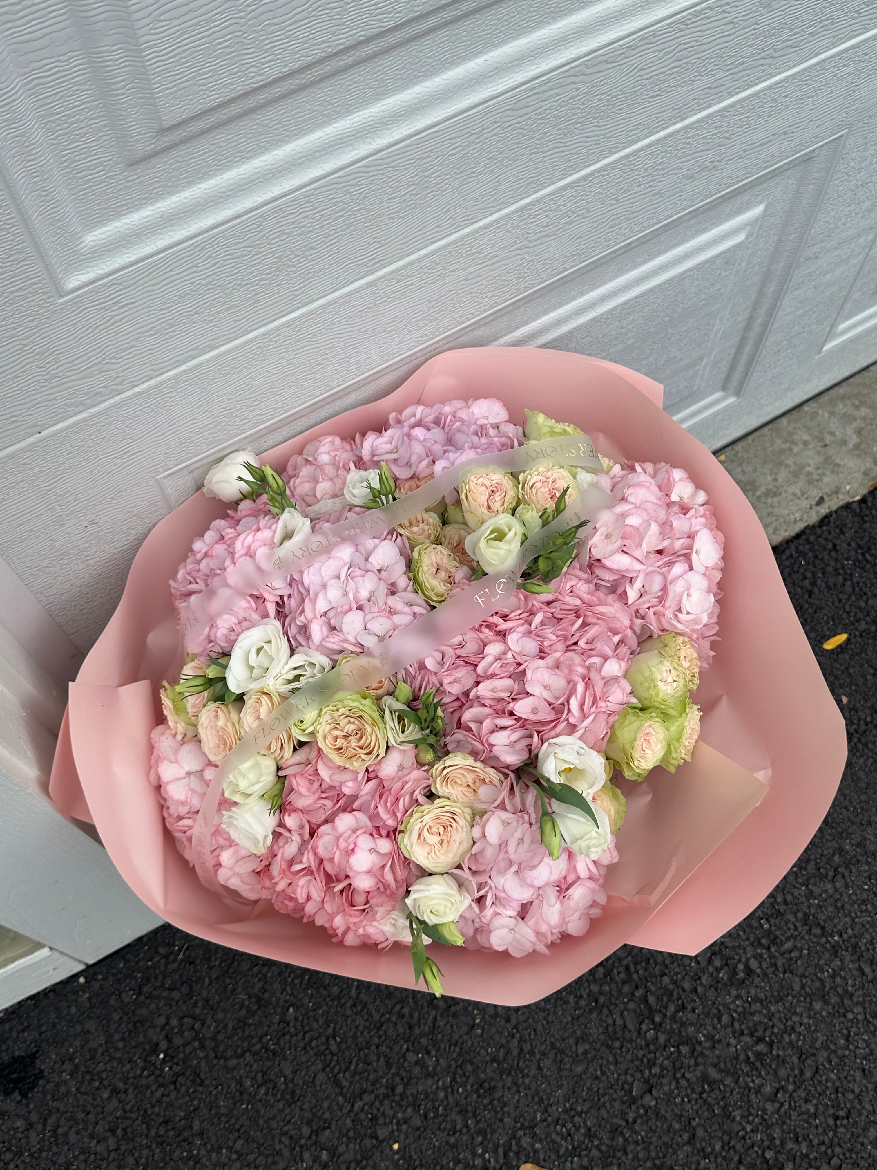 Charming mix of pink hydrangeas & roses