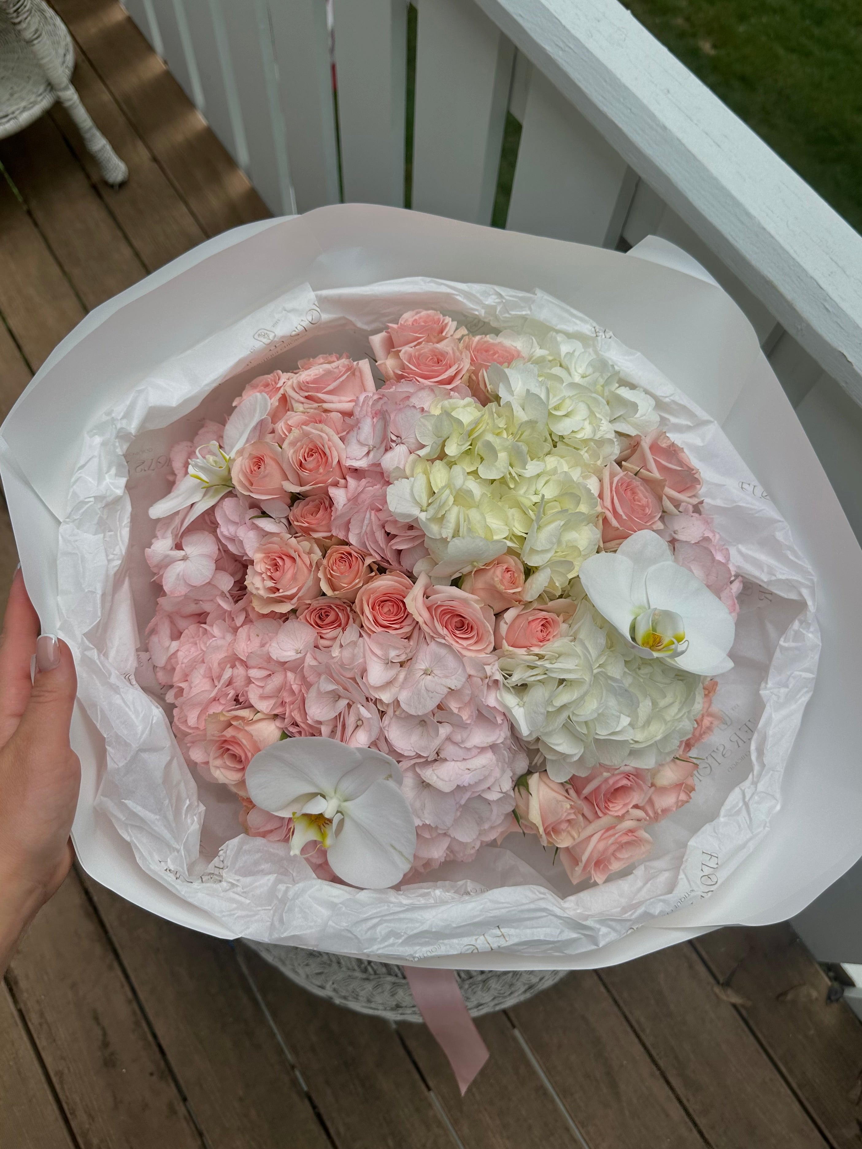 Mix bouquet with orchids, hydrangeas and roses