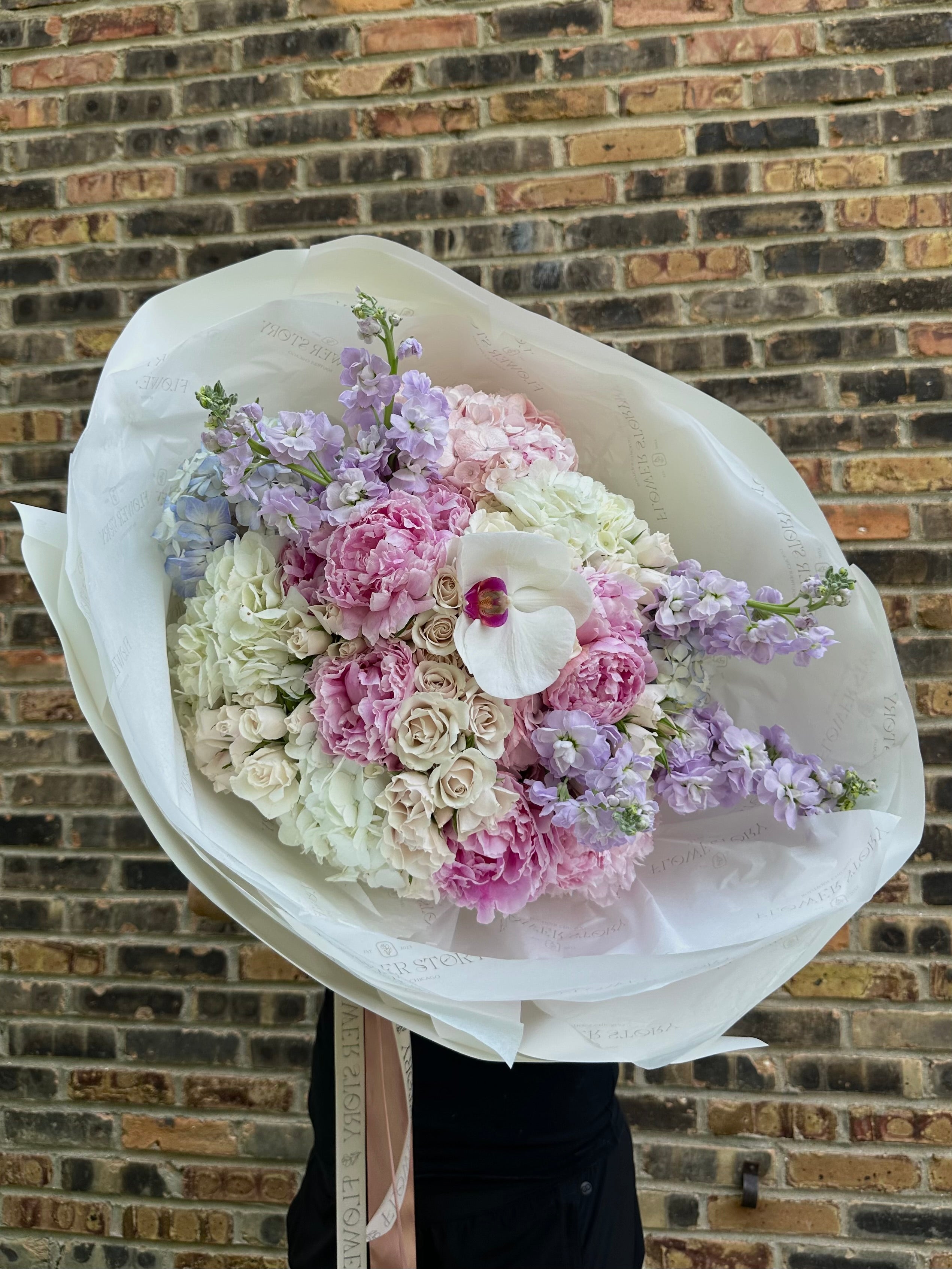 Mix bouquet with peonies, stocks, spray roses, hydrangeas and orchid