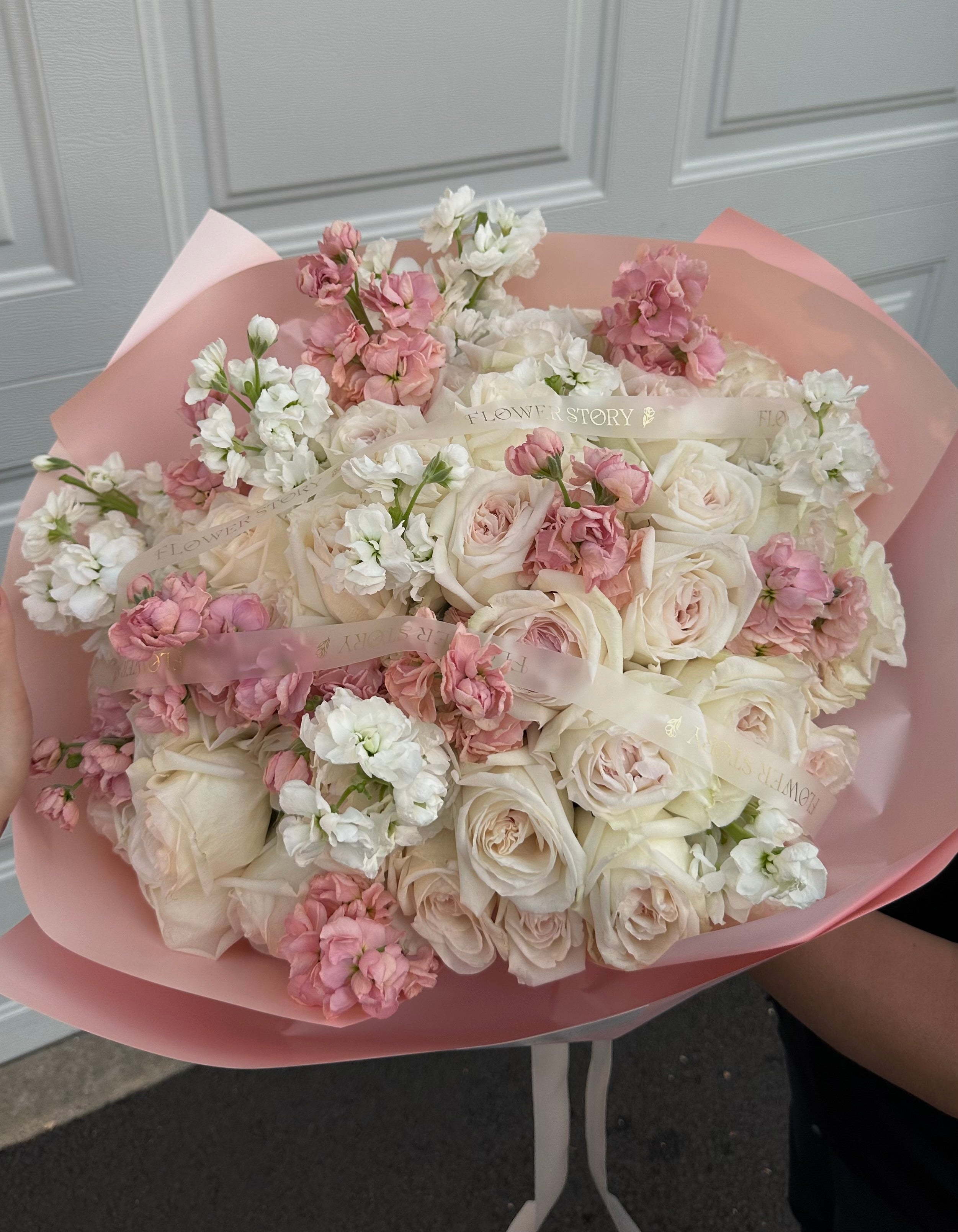 Mixed bouquet of pink stocks, white hydrangeas & roses