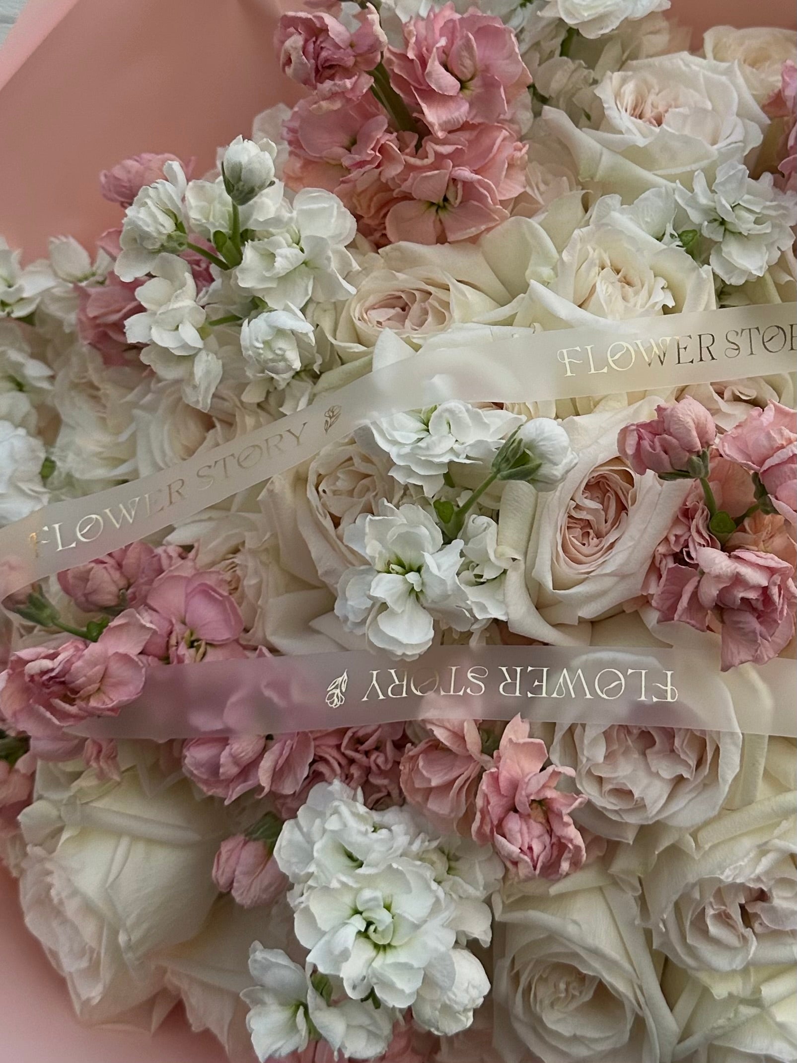 Mixed bouquet of pink stocks, white hydrangeas & roses