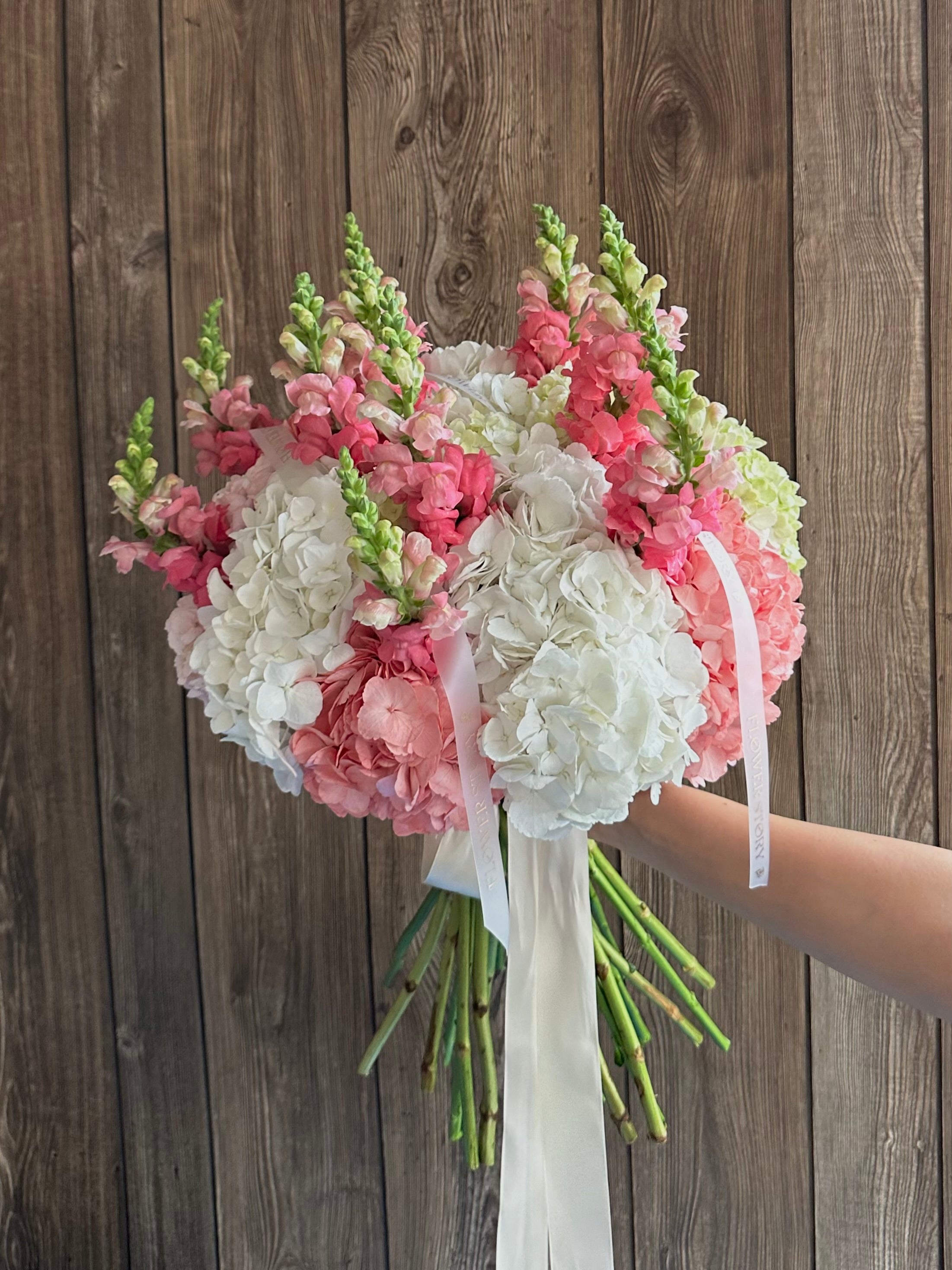 Mix bouquet of white and pink hydrangeas with Snapdragon