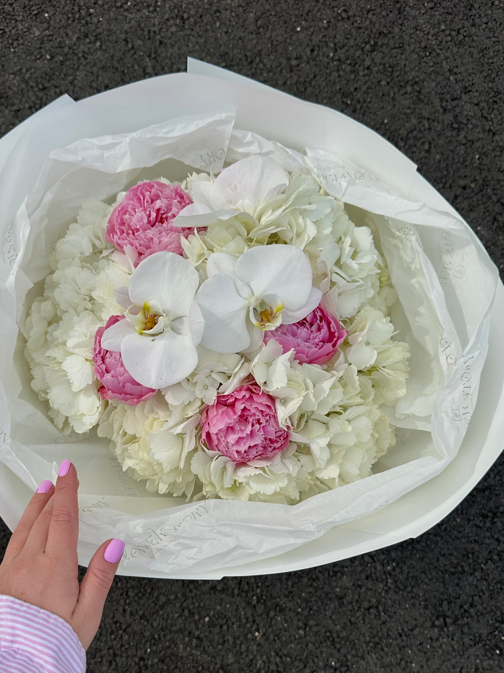 Elegant mix of orchids, peonies & hydrangeas