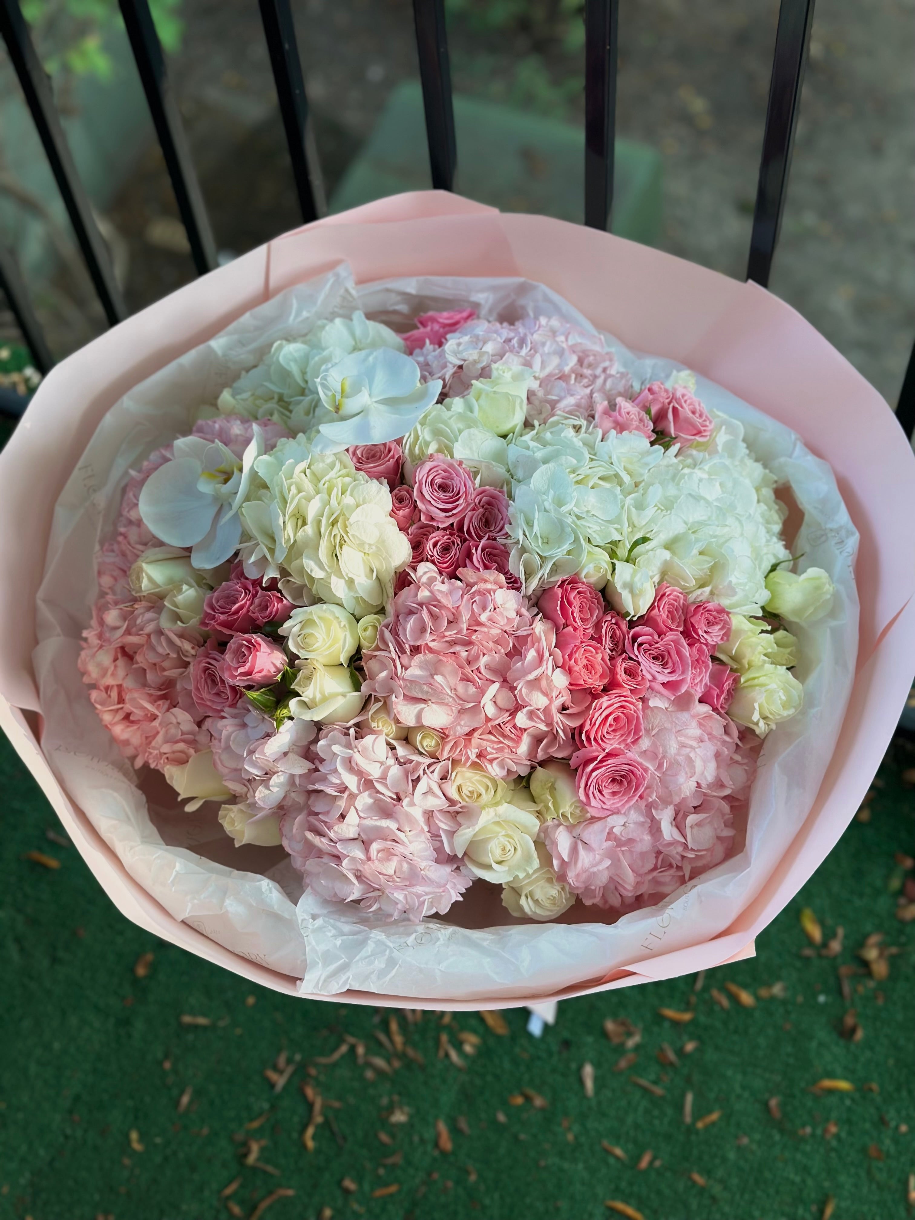 Elegant floral mix with hydrangeas, orchids & spray roses