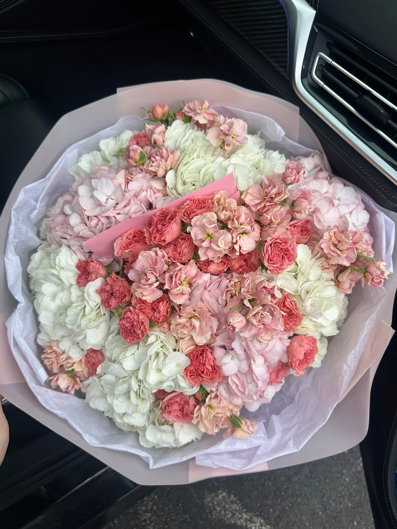 Mix bouquet with hydrangeas, сoral roses & stocks