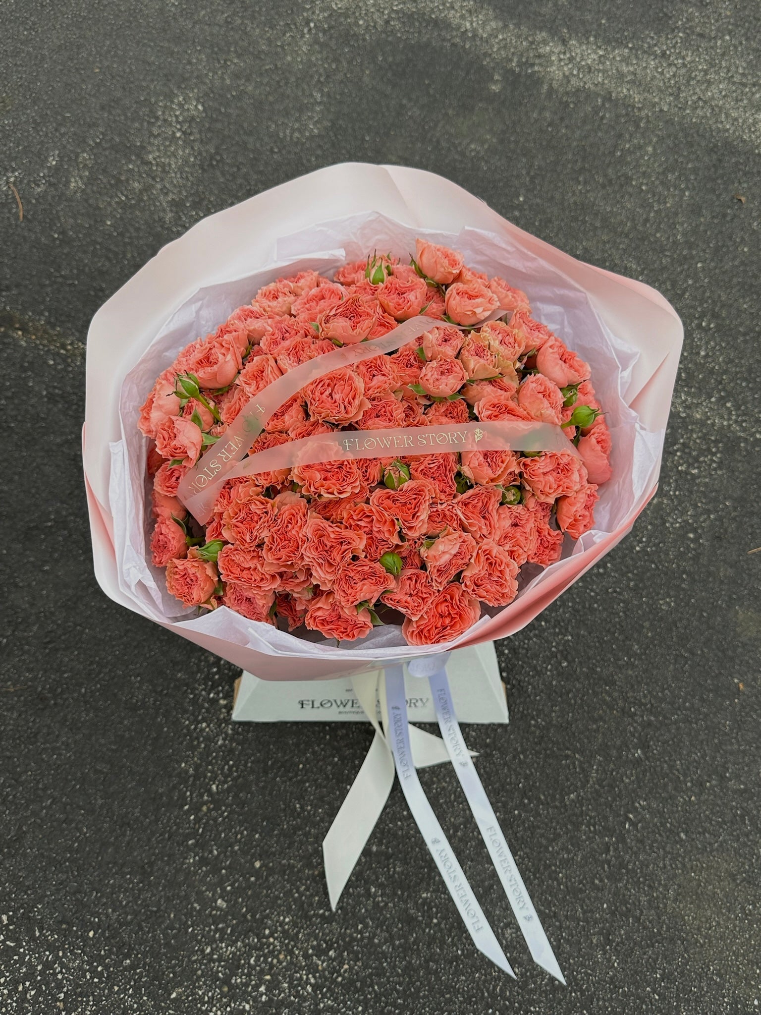 Mono bouquet of coral spray roses