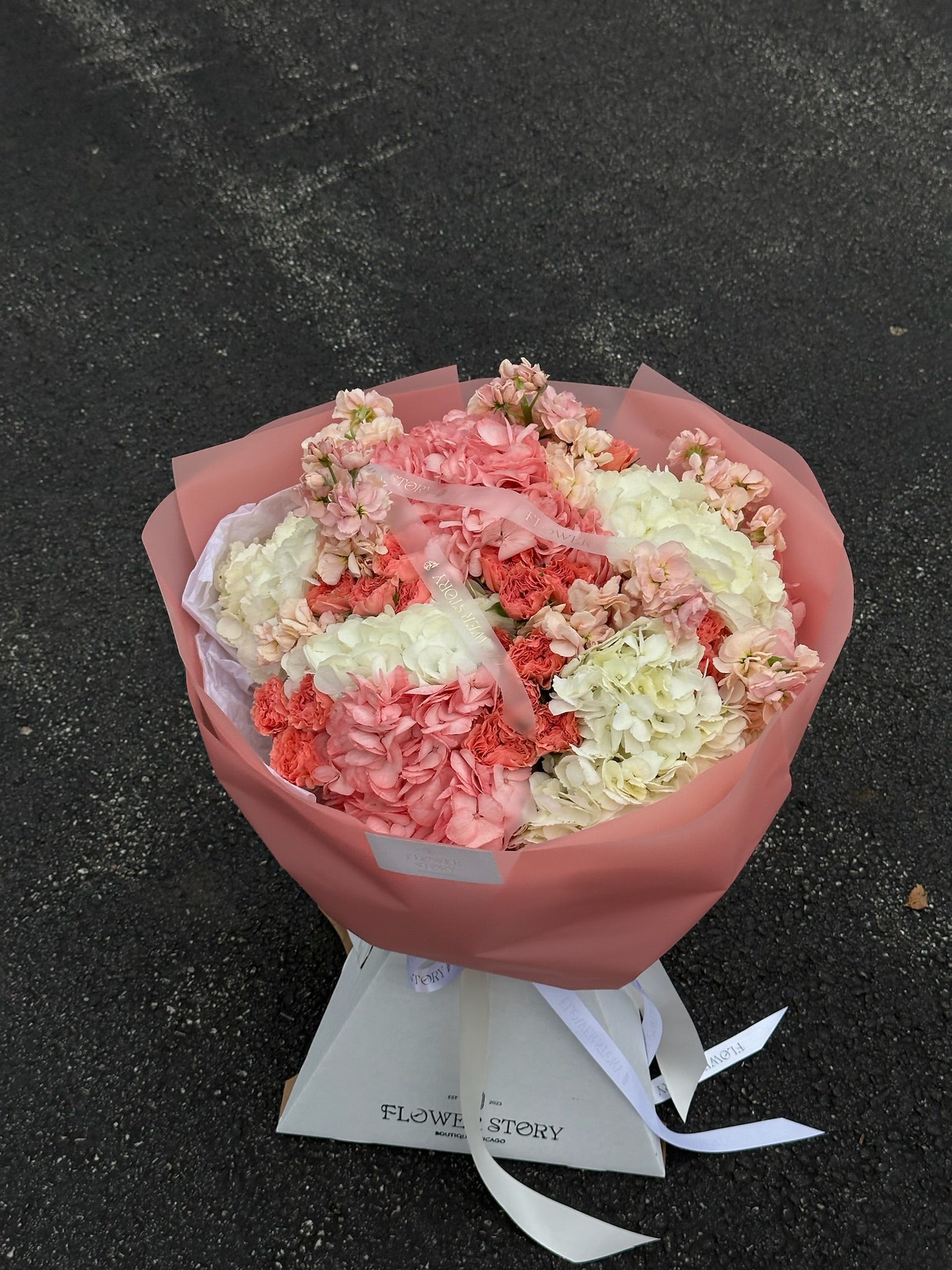 Mix bouquet with hydrangeas, сoral roses & stocks