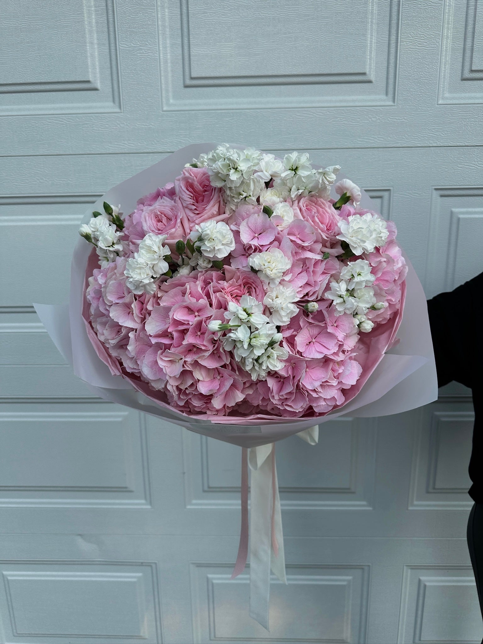 Mix bouquet of pink hydrangeas, roses & white stock