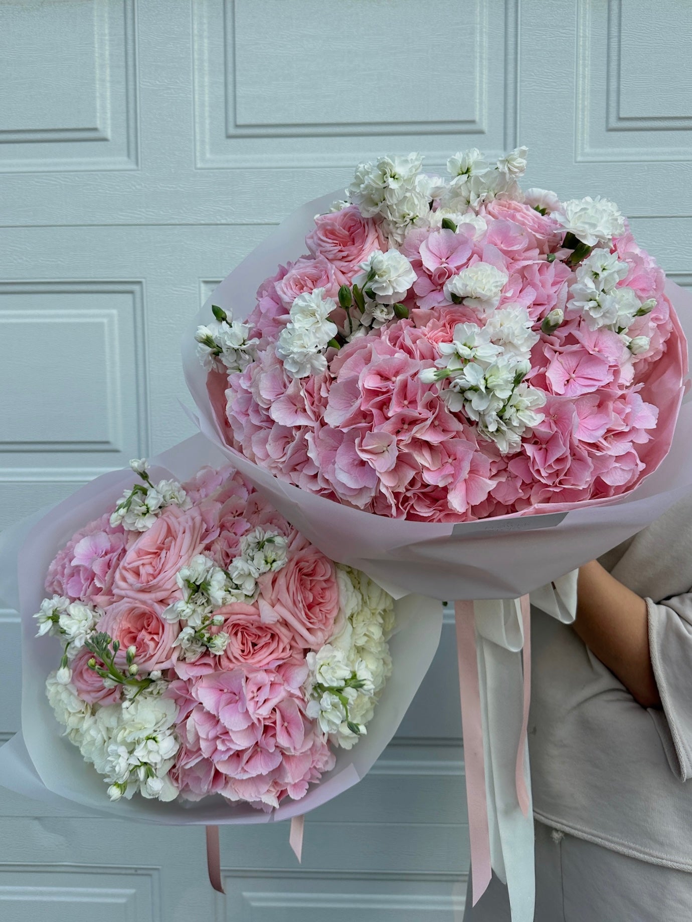 Mix bouquet of pink hydrangeas, roses & white stock